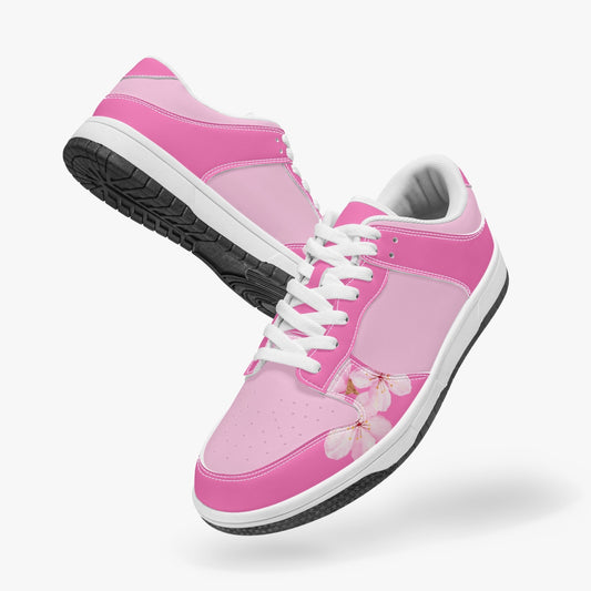 Unique pink low top leather sneakers. Crafted with premium leather, these sneakers feature pink color ways and watercolor Sakura flowers for a playful look. Versatile and durable. Shop now for a bold fashion statement!