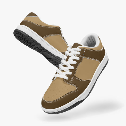 Unique brown low top leather sneakers. Crafted with premium leather, these sneakers feature a deep brown and light brown color palette for a playful look. Versatile and durable. Shop now for a bold fashion statement!